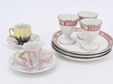 three cups and saucers sitting on a white table