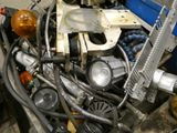 a pile of assorted metal pipes and hoses