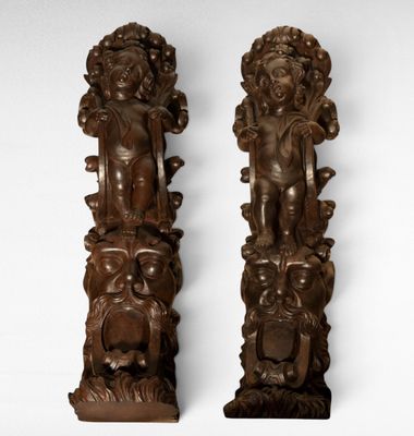 pair of carved wood figures of a woman and a man