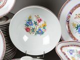 a lot of plates that are sitting on a table