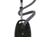 un aspirateur noir muni d'un tuyau sur le dessus