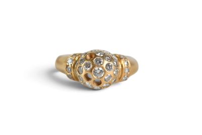 a close up of a gold and diamond ring on a white background