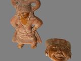 deux figurines en argile représentant une femme et un homme sur un fond gris