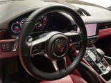 the interior of a car with a steering wheel and dashboard controls