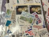 many different stamps in a plastic bag on the table