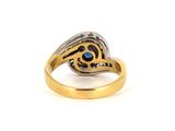 an image of a gold ring with a blue stone in the center