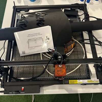 a table with a lot of wires and a blower