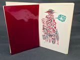 two red and white greeting cards with a bird design on them