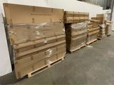 several pallets of cardboard are stacked on pallets in a warehouse