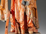 an image of a statue of a man holding a flag
