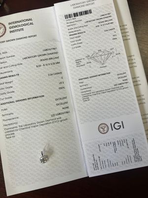 a receipt with a diamond on it sitting on a table