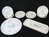a lot of plates and trays that are sitting on a table