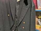 a suit on a hanger in a store