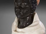 an image of a bust of a man with a scarf around his head