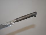 a knife that is sitting on top of a table