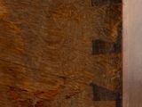 a close up of a piece of wood on a bench