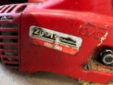a close up of a chainsaw with a chain attached to it