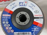 an image of a grinding disc on a table next to a box