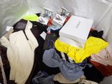 a pile of clothes that is sitting on a table