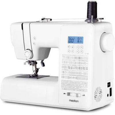 a white sewing machine sitting on top of a white table