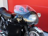 a motorcycle parked in front of a red garage door