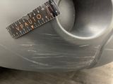 a sticker on the bumper of a car with a ruler attached to it
