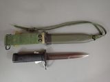 three different types of knives on a white surface
