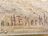 an image of a close up of a metal object with writing on it