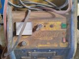 a machine that is sitting on the ground in the garage