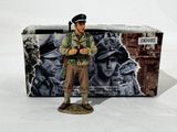 figurine of a soldier with a gun in front of a box