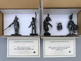 two boxes with three figurines of soldiers in different poses