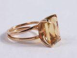 an image of a gold ring with a large citrine stone