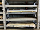 an image of a rack of shelves in a warehouse with a sheet on the floor