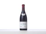 a bottle of red wine sitting on top of a table