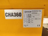 a close up of a yellow machine with a sticker on it