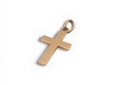 un pendentif en forme de croix dorée sur fond blanc