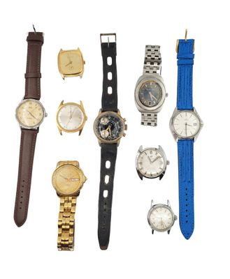 many different types of watches on a white surface