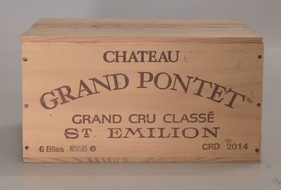 a wooden box with a label on it that says chateau grand pontnet
