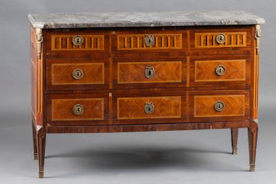 a marble top chest of drawers on a stand