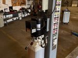 a gas can sitting on a stand in a warehouse