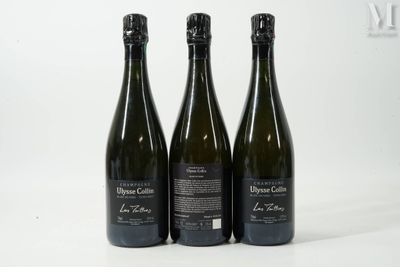 trois bouteilles de vin posées sur une table blanche