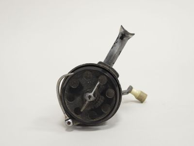 a close up of a clock on a white surface with a white background
