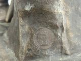 a close up of a statue of a man with a hat on