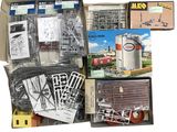 a box full of assorted model trains and other items