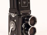 an old photo of a rolleiflex camera on a white background