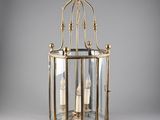 a large brass lantern hanging from the ceiling