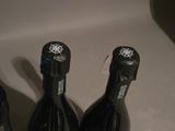 three bottles of wine that are sitting on a counter