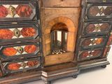 a cabinet with a fireplace in the middle of it