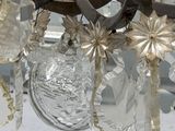 a chandelier made of glass hanging from the ceiling