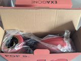 packaging of a pair of pink shoes in a box on a table